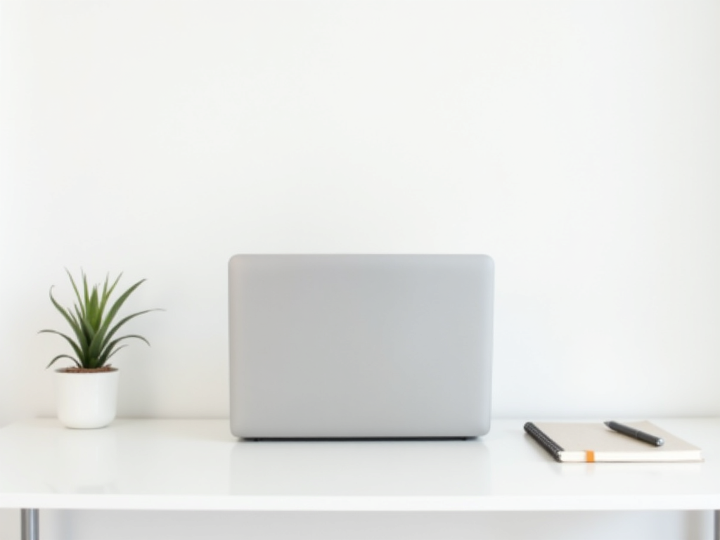 Ein minimalistischer Arbeitsplatz mit einem einfachen Schreibtisch und wenigen Gegenständen.
