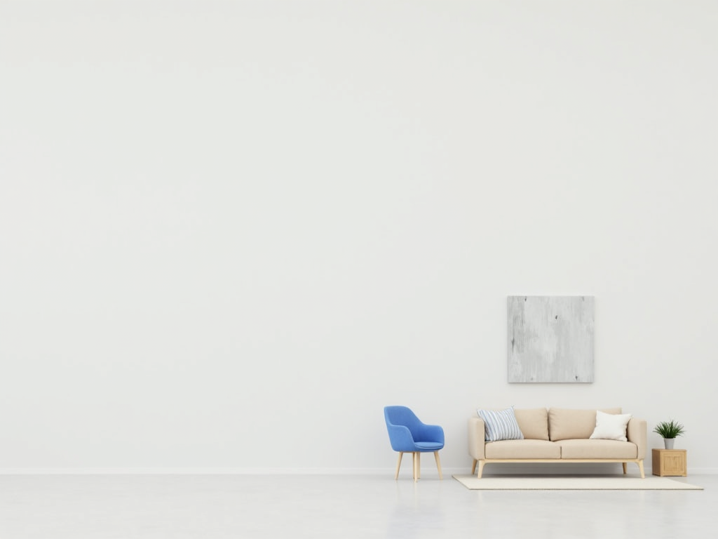 Ein minimalistisches Wohnzimmer mit weißen Wänden, hellgrauem Boden, einem beigen Sofa und einem blauen Akzentstuhl. Dekoriert mit einer kleinen Topfpflanze auf einem Holztisch und einem abstrakten Gemälde an der Wand.